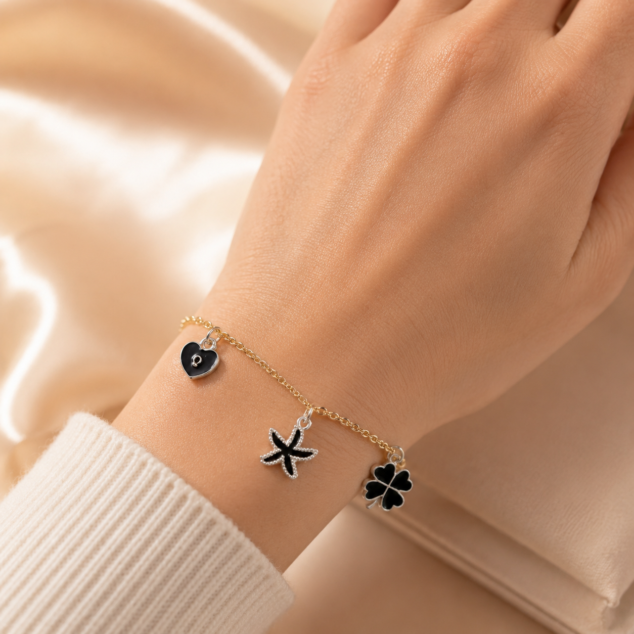 Elegant Gold Charm Bracelet with Black Heart