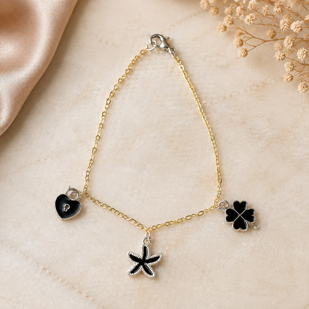 Elegant Gold Charm Bracelet with Black Heart